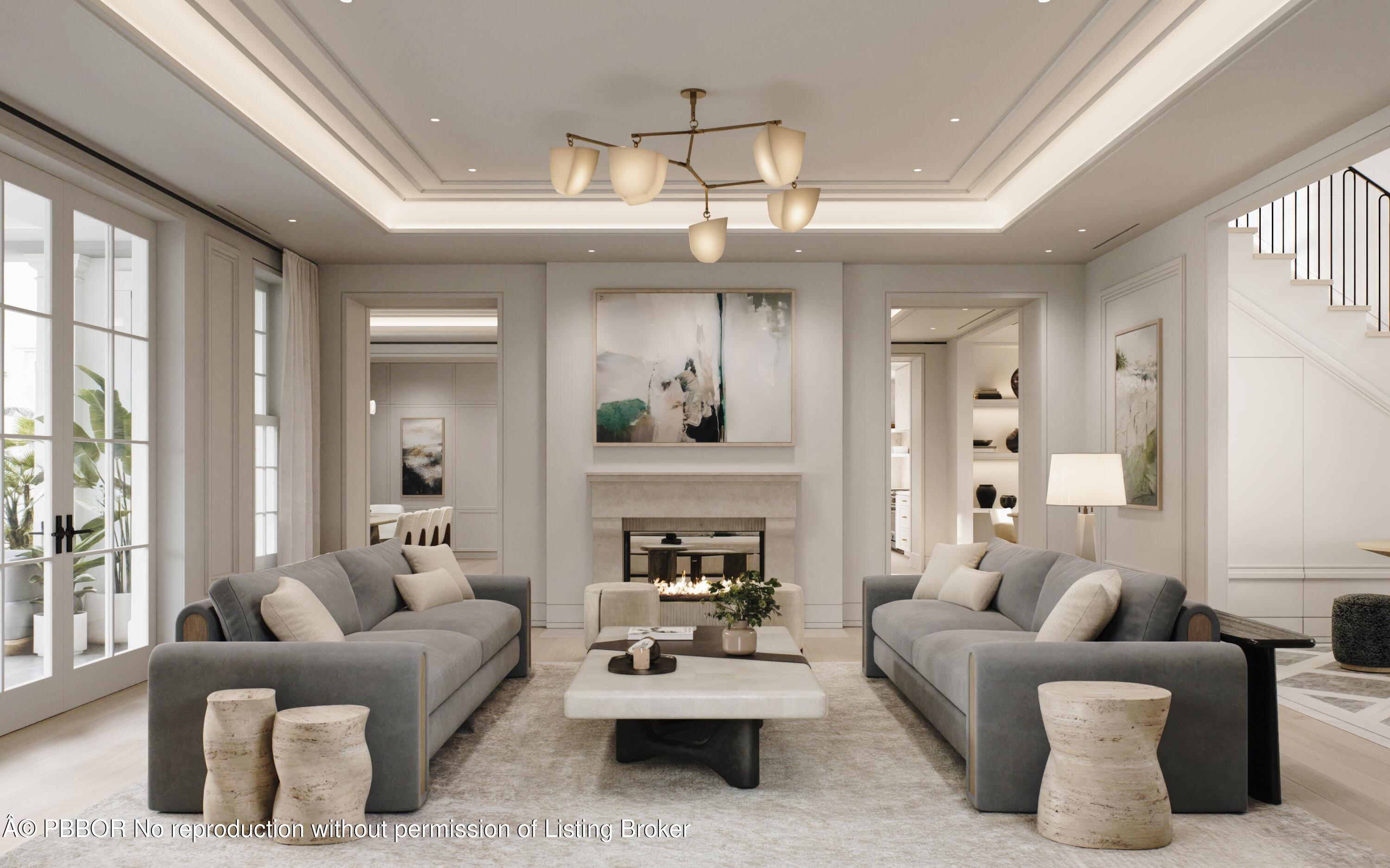 124 Cocoanut Row Palm Beach, FL 33480 - Photo 6 of 15 a living room with furniture a chandelier and a fireplace