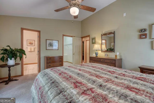 a bathroom with a sink a toilet and shower curtain