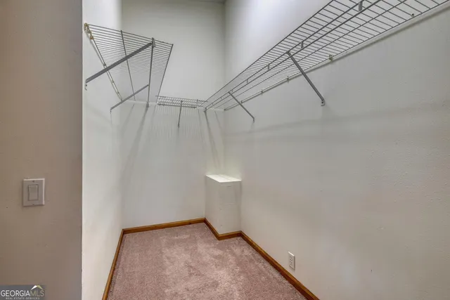 a bathroom with a sink a toilet and shower curtain