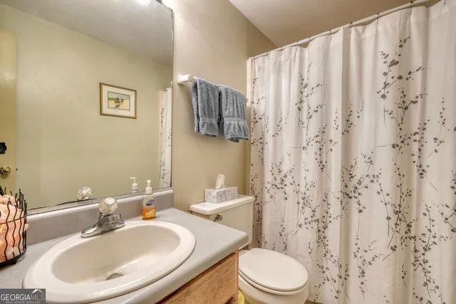 a bedroom with furniture and a gym equipment