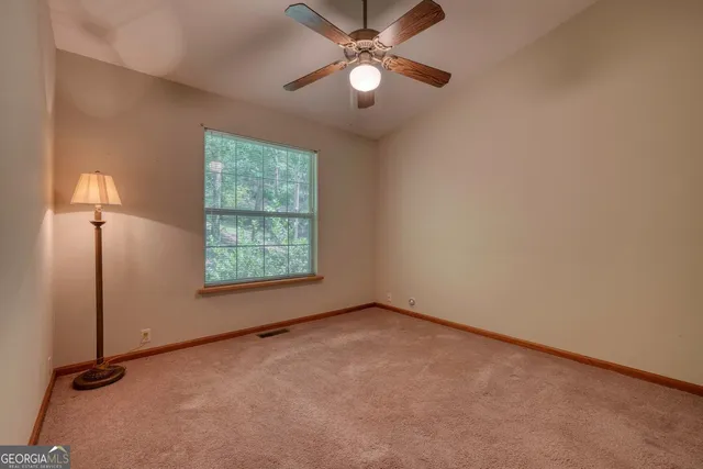 a view of a backyard with sitting area