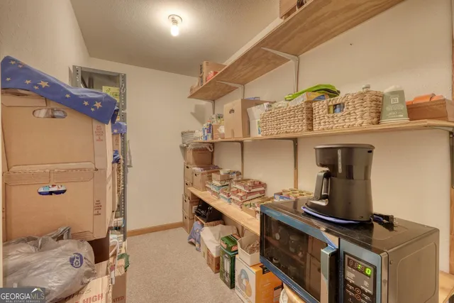 a view of a wooden deck and lake