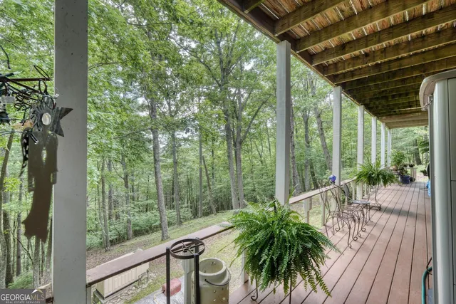 an aerial view of residential house with green space