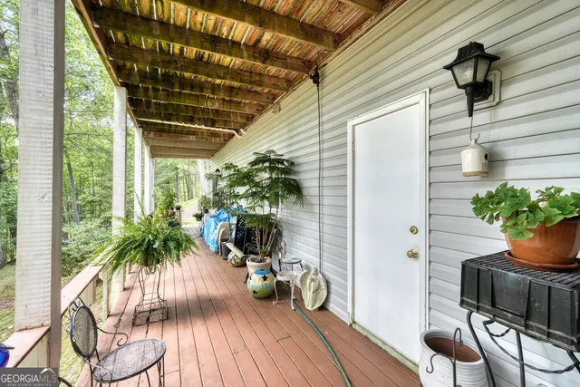 a view of a lush green hillside and a houses