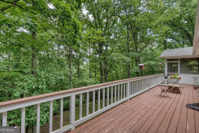 a view of a lush green hillside and a houses