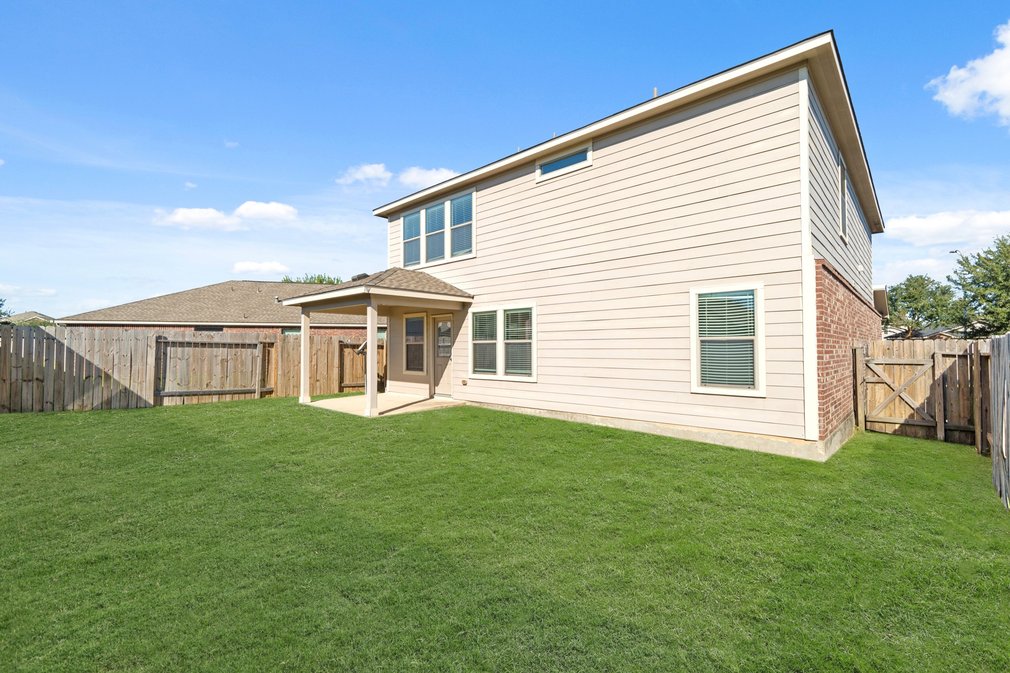 21359 Bandera Ranch Lane Katy, TX 77449 - Photo 16 of 31 a view of a house with a backyard
