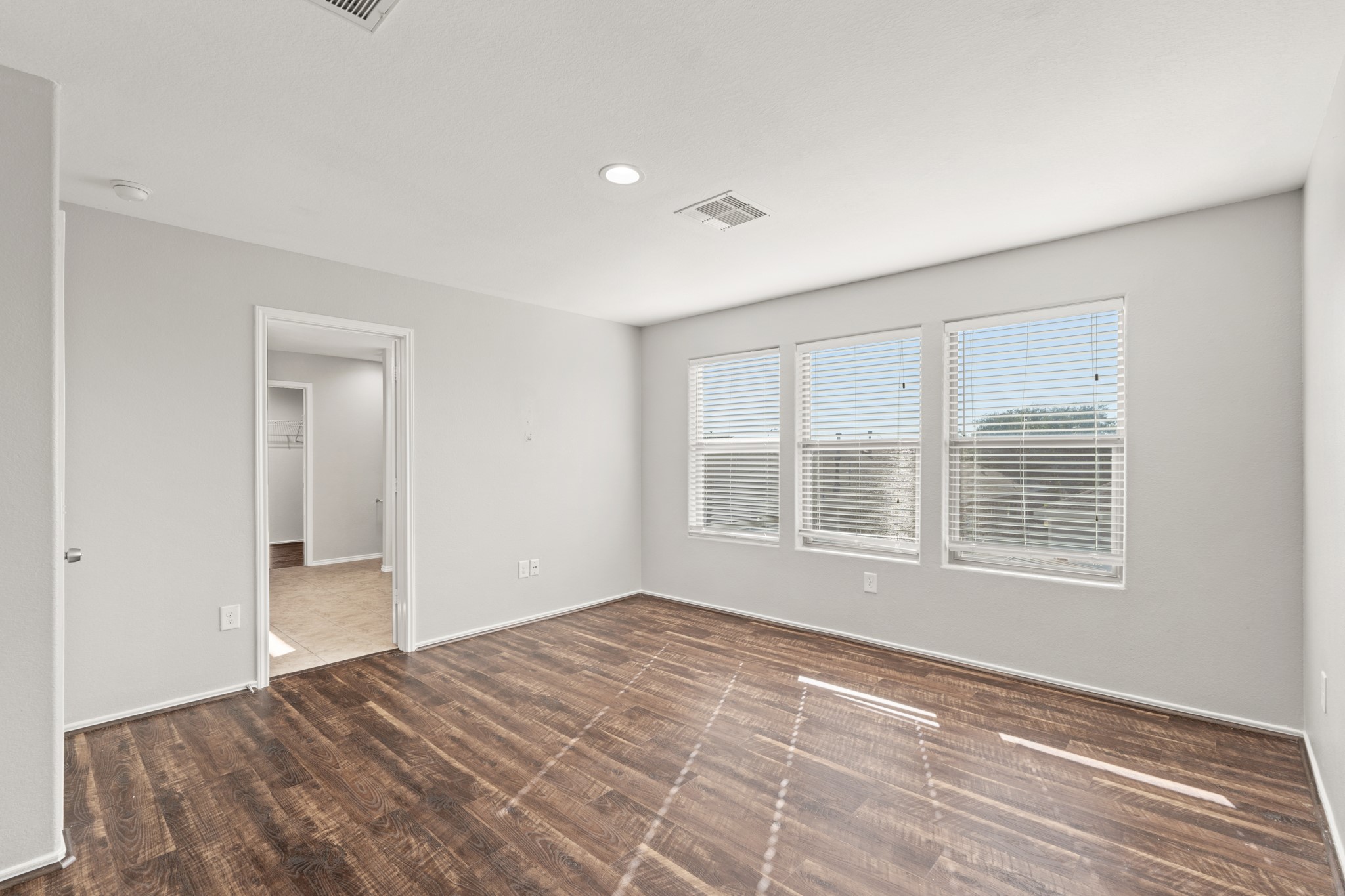 21359 Bandera Ranch Lane Katy, TX 77449 - Photo 19 of 31 a view of empty room with wooden floor and fan