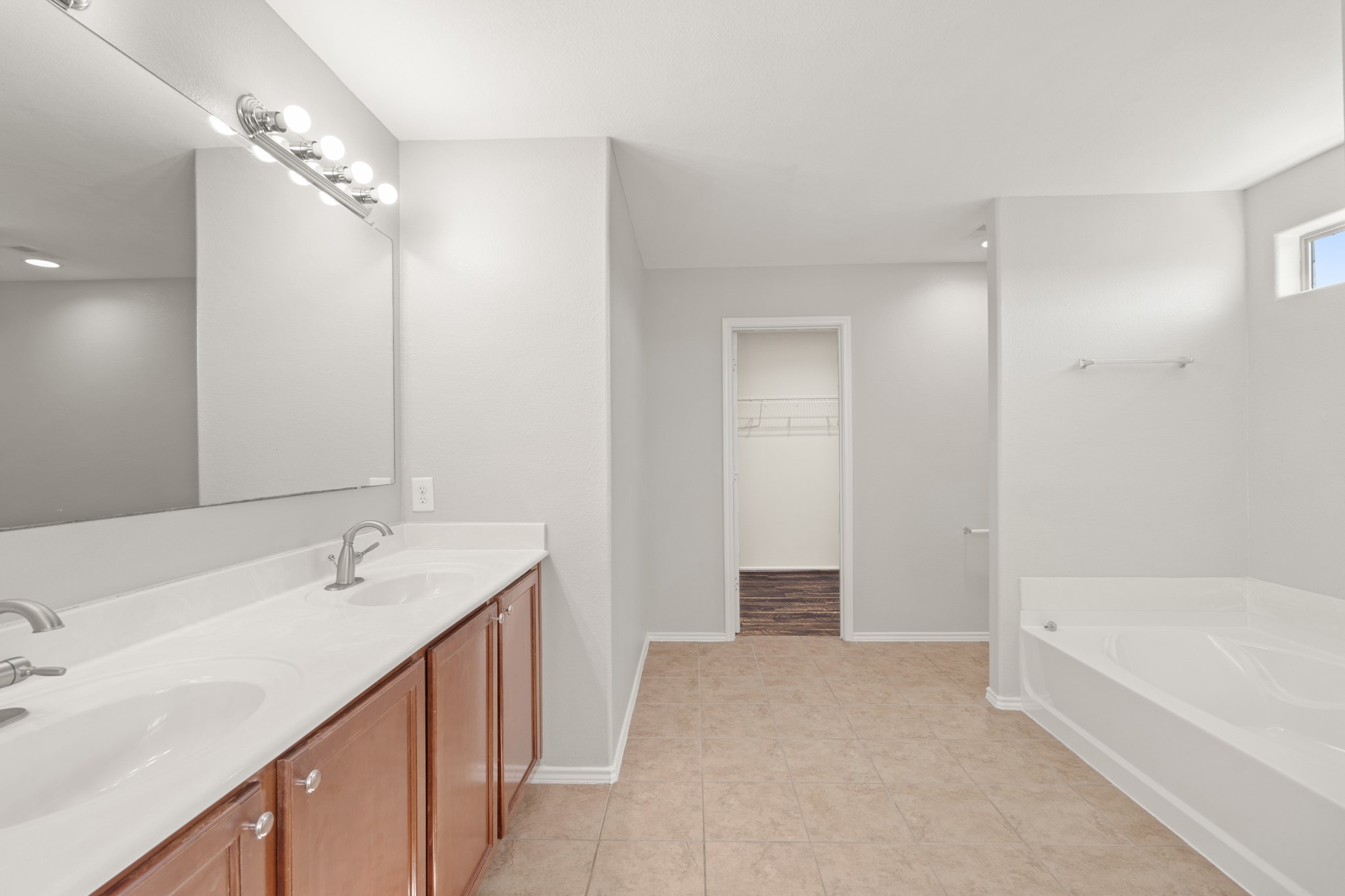 21359 Bandera Ranch Lane Katy, TX 77449 - Photo 20 of 31 a bathroom with a tub sink and mirror