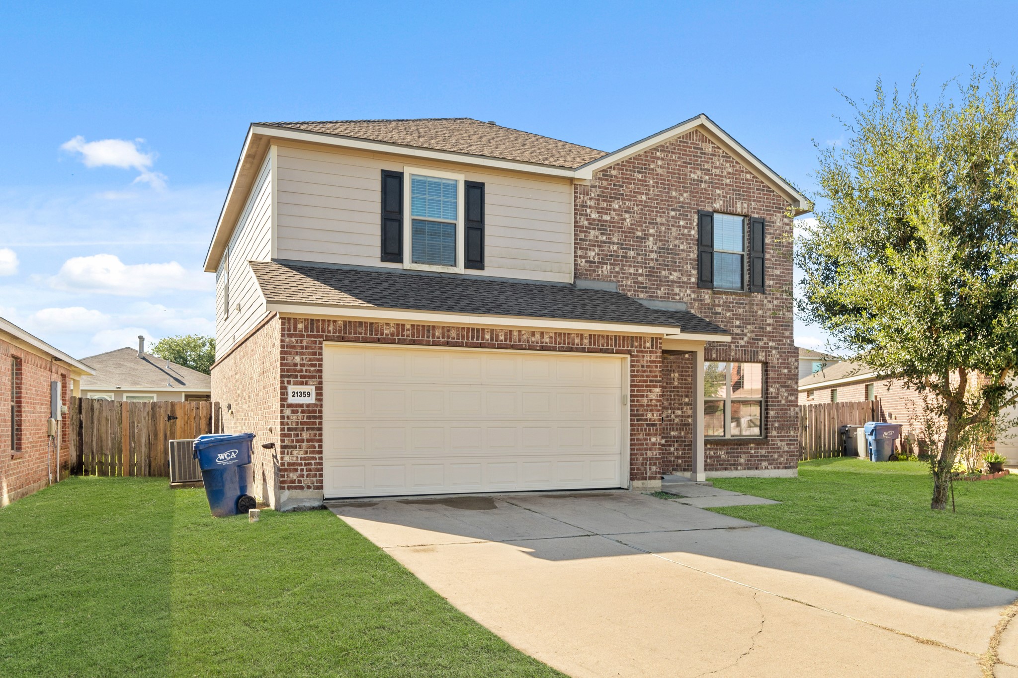 21359 Bandera Ranch Lane Katy, TX 77449 - Photo 2 of 31 a front view of a house with a yard and garage