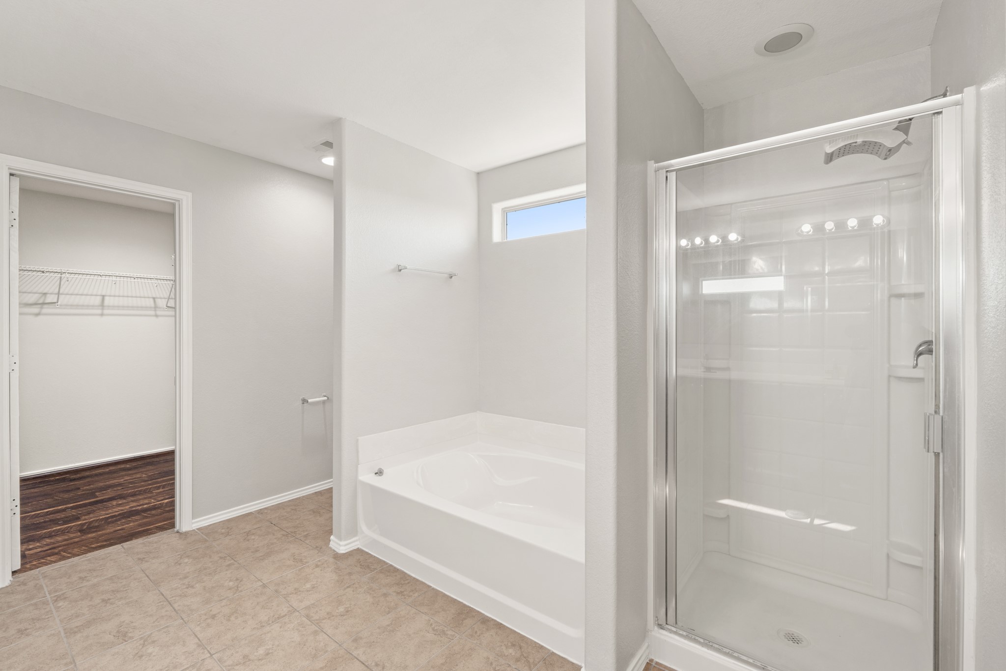 21359 Bandera Ranch Lane Katy, TX 77449 - Photo 21 of 31 a bathroom with a bathtub and a shower