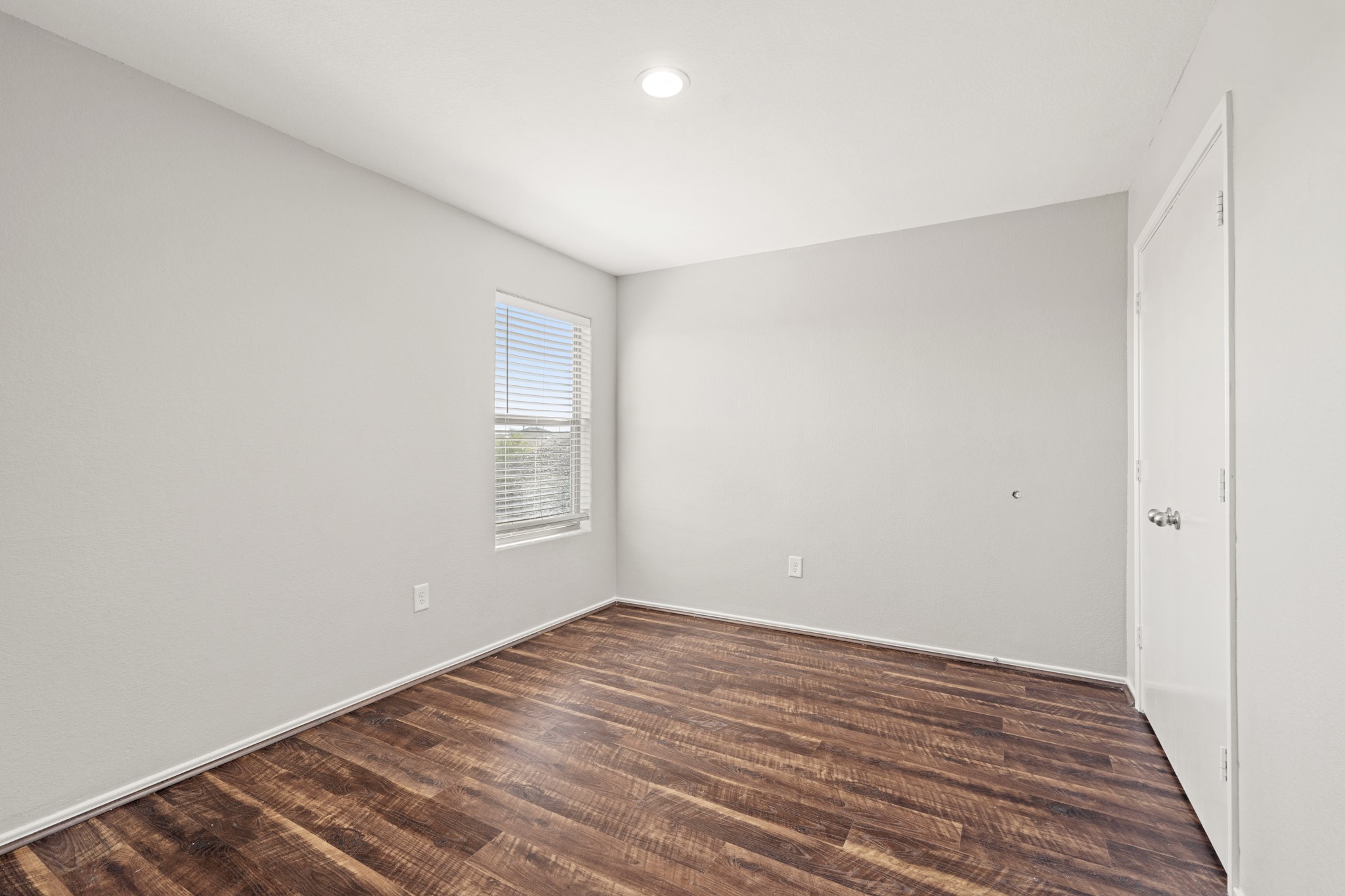 21359 Bandera Ranch Lane Katy, TX 77449 - Photo 27 of 31 a view of an empty room with wooden floor