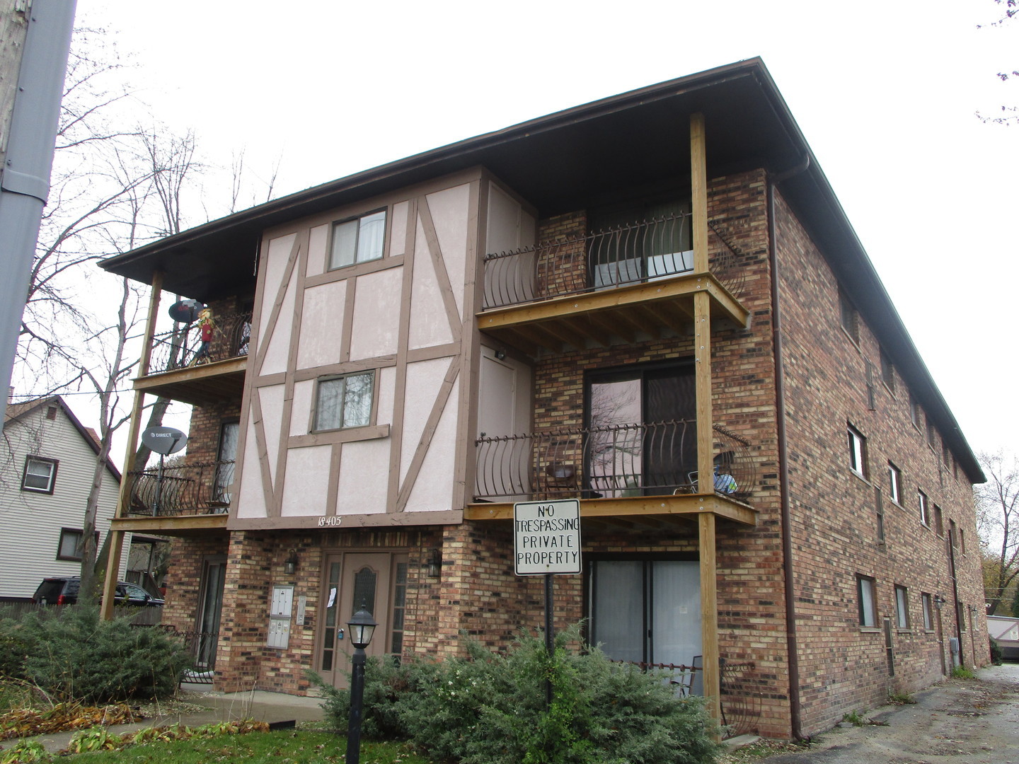18405 Wentworth Avenue, Unit 1D Lansing, IL 60438 - Photo 2 of 6 a front view of a house with glass windows