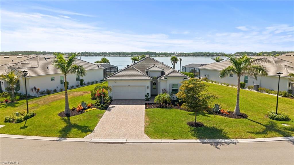 13654 Blue Bay Circle Fort Myers, FL 33913 - Photo 1 of 50 a view of a house with a yard and potted plants