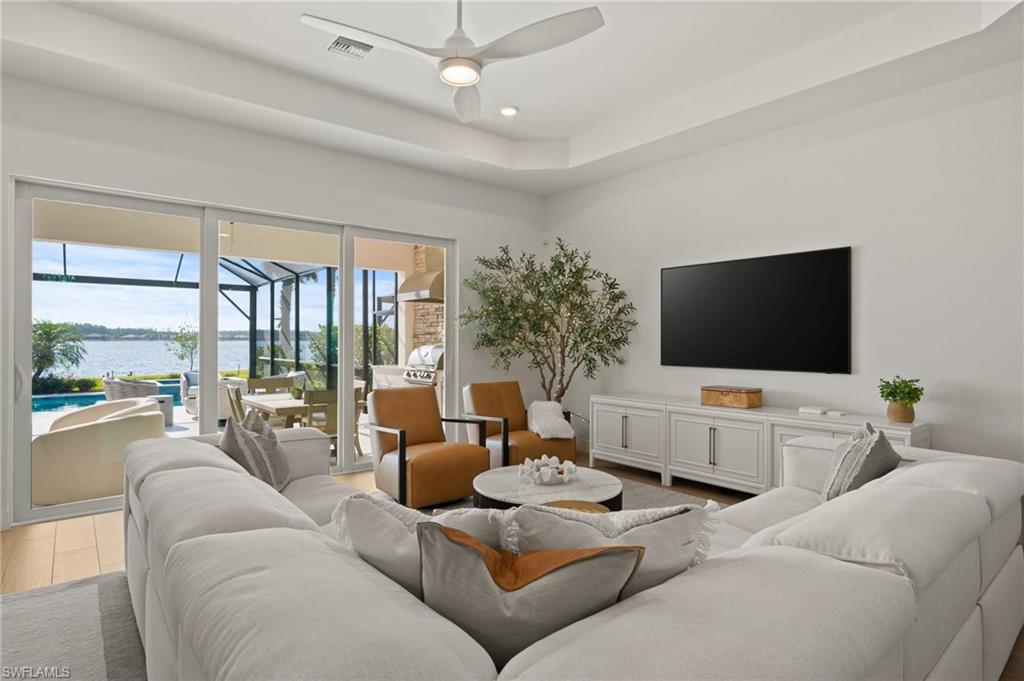 13654 Blue Bay Circle Fort Myers, FL 33913 - Photo 14 of 50 a living room with furniture and a flat screen tv
