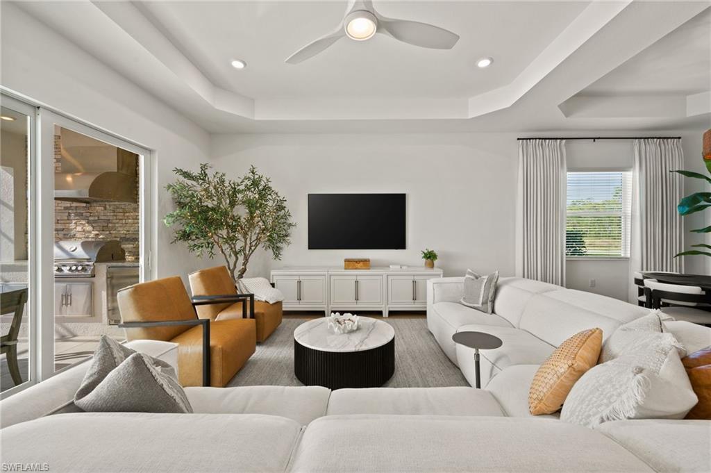 13654 Blue Bay Circle Fort Myers, FL 33913 - Photo 15 of 50 a living room with furniture and a flat screen tv