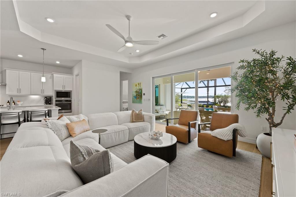 13654 Blue Bay Circle Fort Myers, FL 33913 - Photo 16 of 50 a living room with furniture and a large window
