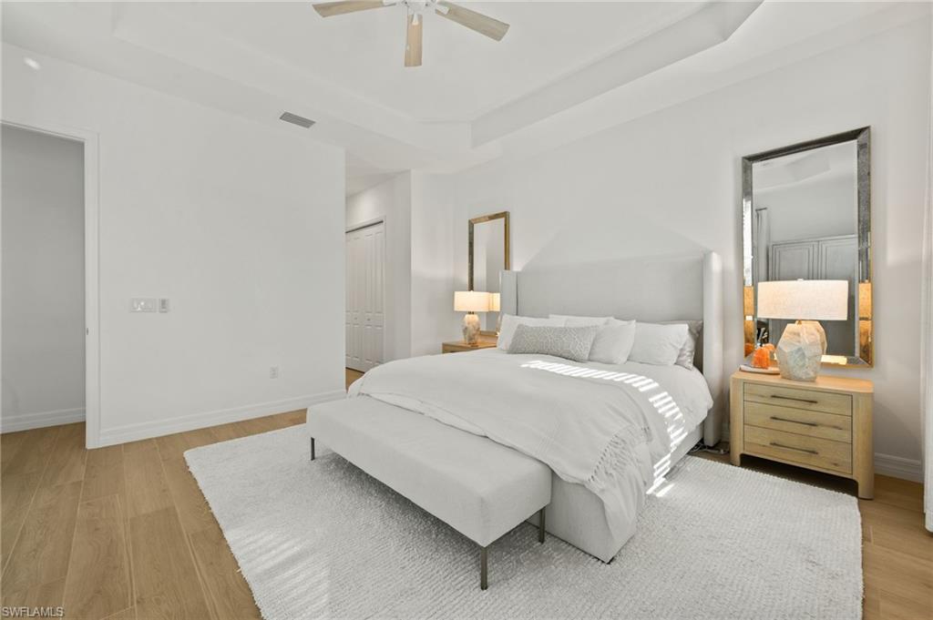 13654 Blue Bay Circle Fort Myers, FL 33913 - Photo 19 of 50 a bedroom with a bed and a dresser