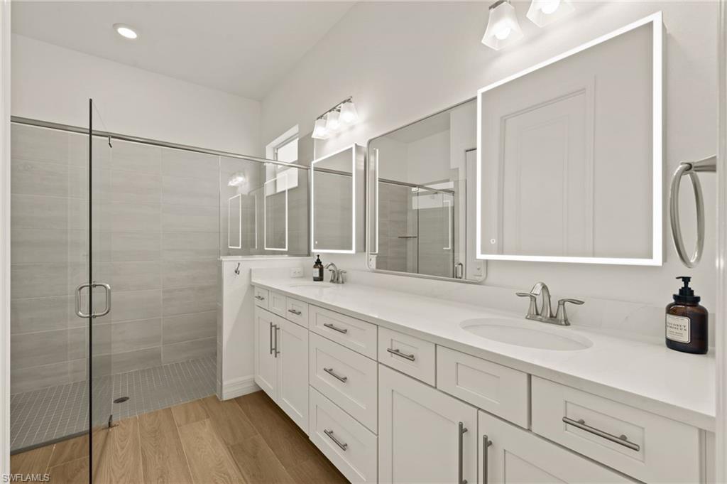 13654 Blue Bay Circle Fort Myers, FL 33913 - Photo 20 of 50 a bathroom with a double vanity sink mirror and double