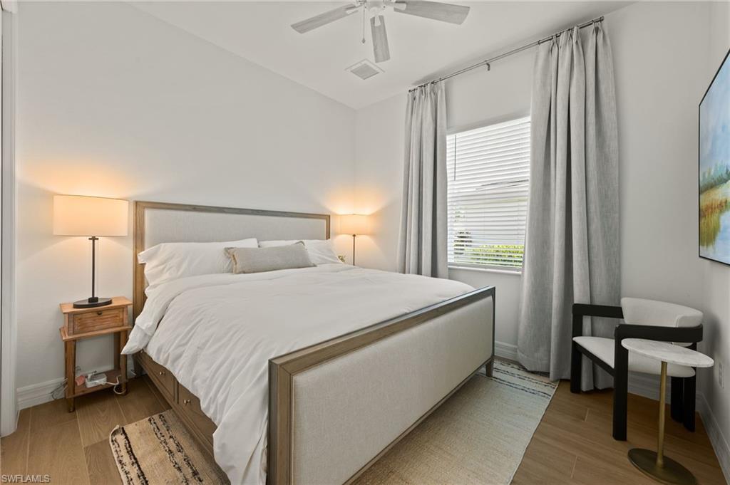13654 Blue Bay Circle Fort Myers, FL 33913 - Photo 21 of 50 a bedroom with a bed and a window