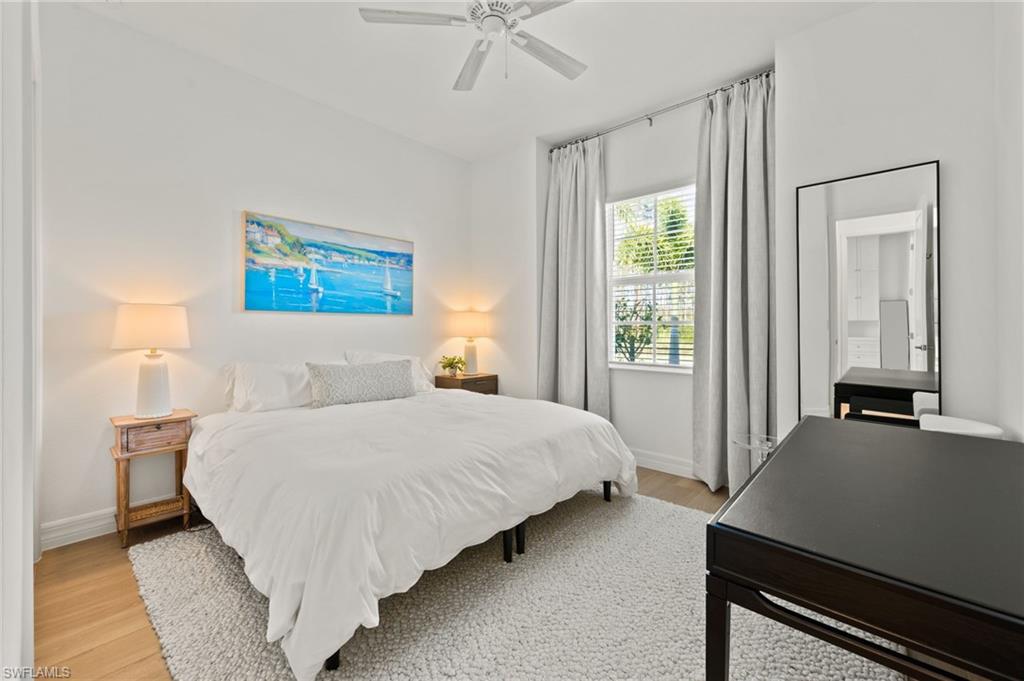 13654 Blue Bay Circle Fort Myers, FL 33913 - Photo 23 of 50 a bedroom with a bed and a chandelier