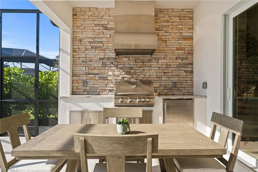13654 Blue Bay Circle Fort Myers, FL 33913 - Photo 29 of 50 a outdoor dining space with furniture and outdoor view