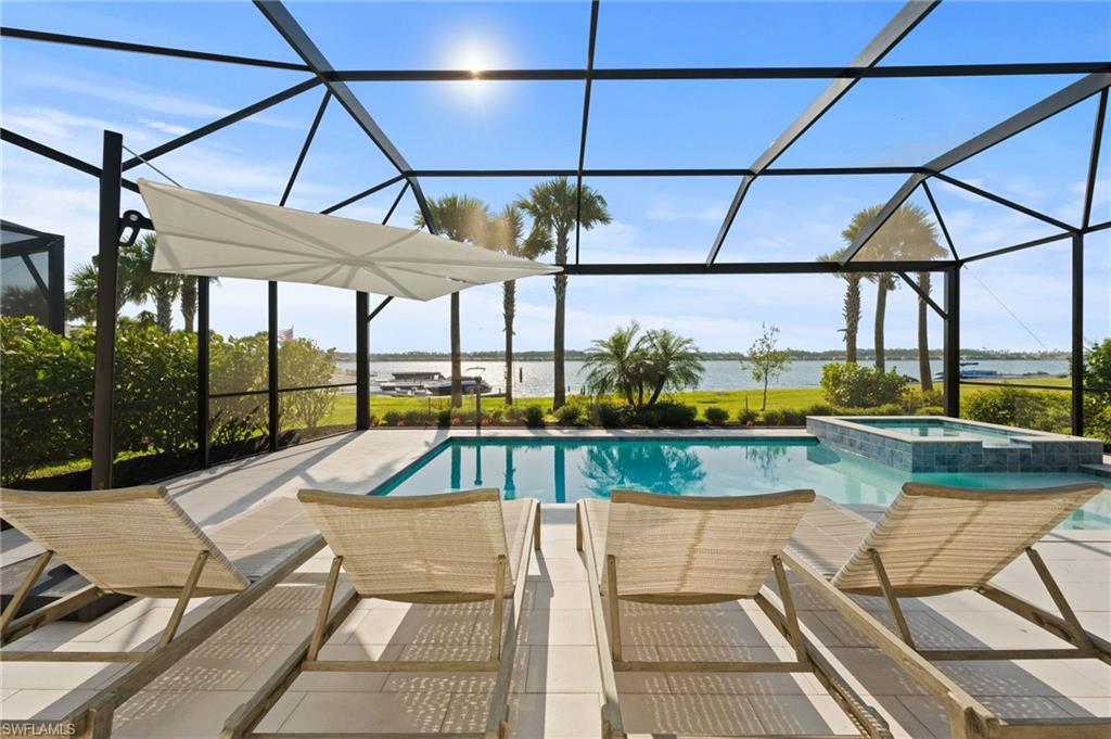 13654 Blue Bay Circle Fort Myers, FL 33913 - Photo 33 of 50 a view of a swimming pool with a patio