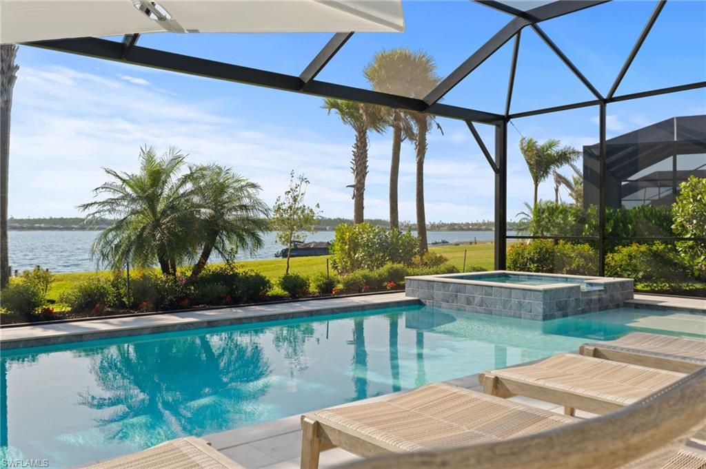 13654 Blue Bay Circle Fort Myers, FL 33913 - Photo 34 of 50 a view of a swimming pool with a patio