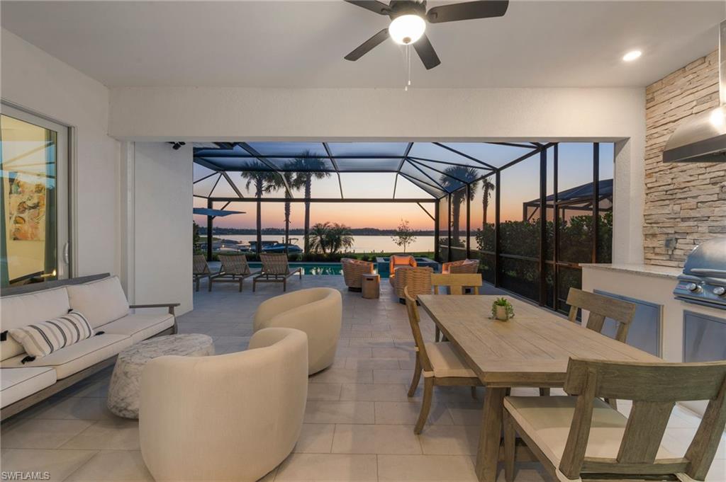 13654 Blue Bay Circle Fort Myers, FL 33913 - Photo 35 of 50 a dining room with furniture and a floor to ceiling window