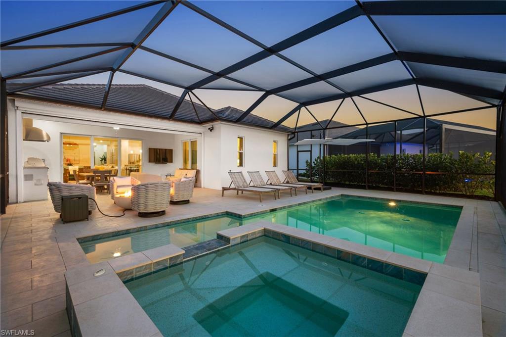13654 Blue Bay Circle Fort Myers, FL 33913 - Photo 38 of 50 a view of a swimming pool with a patio