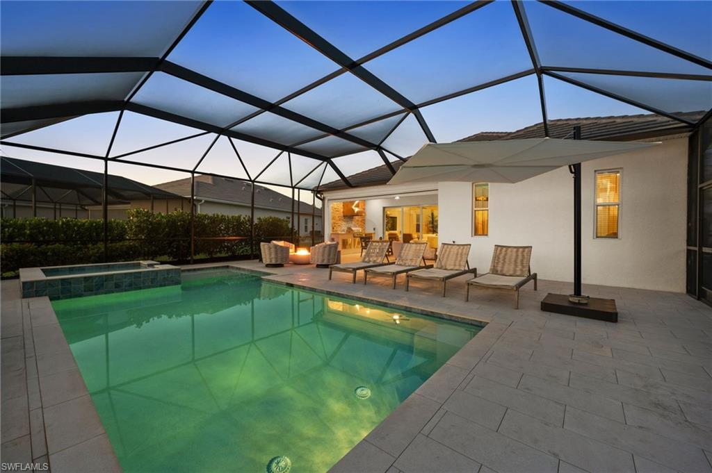 13654 Blue Bay Circle Fort Myers, FL 33913 - Photo 40 of 50 a view of a swimming pool with a patio
