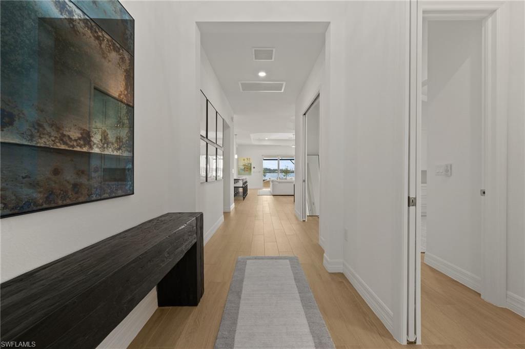 13654 Blue Bay Circle Fort Myers, FL 33913 - Photo 4 of 50 a view of a hallway with wooden floor and staircase