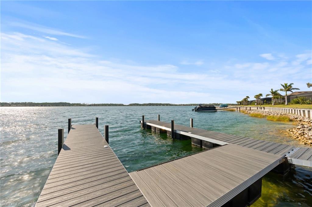 13654 Blue Bay Circle Fort Myers, FL 33913 - Photo 42 of 50 a view of a lake with tables and chairs