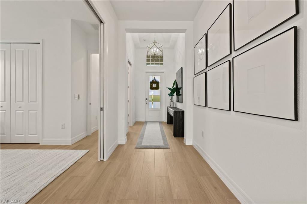 13654 Blue Bay Circle Fort Myers, FL 33913 - Photo 5 of 50 a view of a hallway with wooden floor