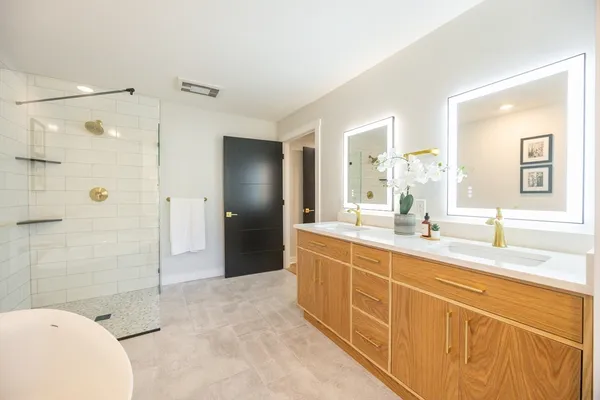 a hallway with a table and a potted plant