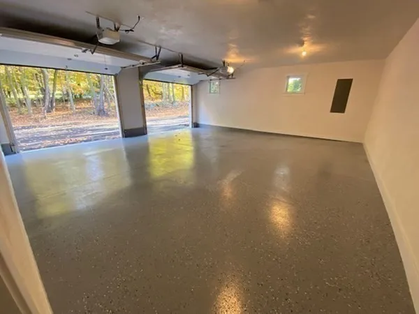 a view of a fountain in a yard next to a road