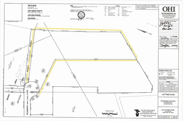 a bathroom with a potted plant and cabinets
