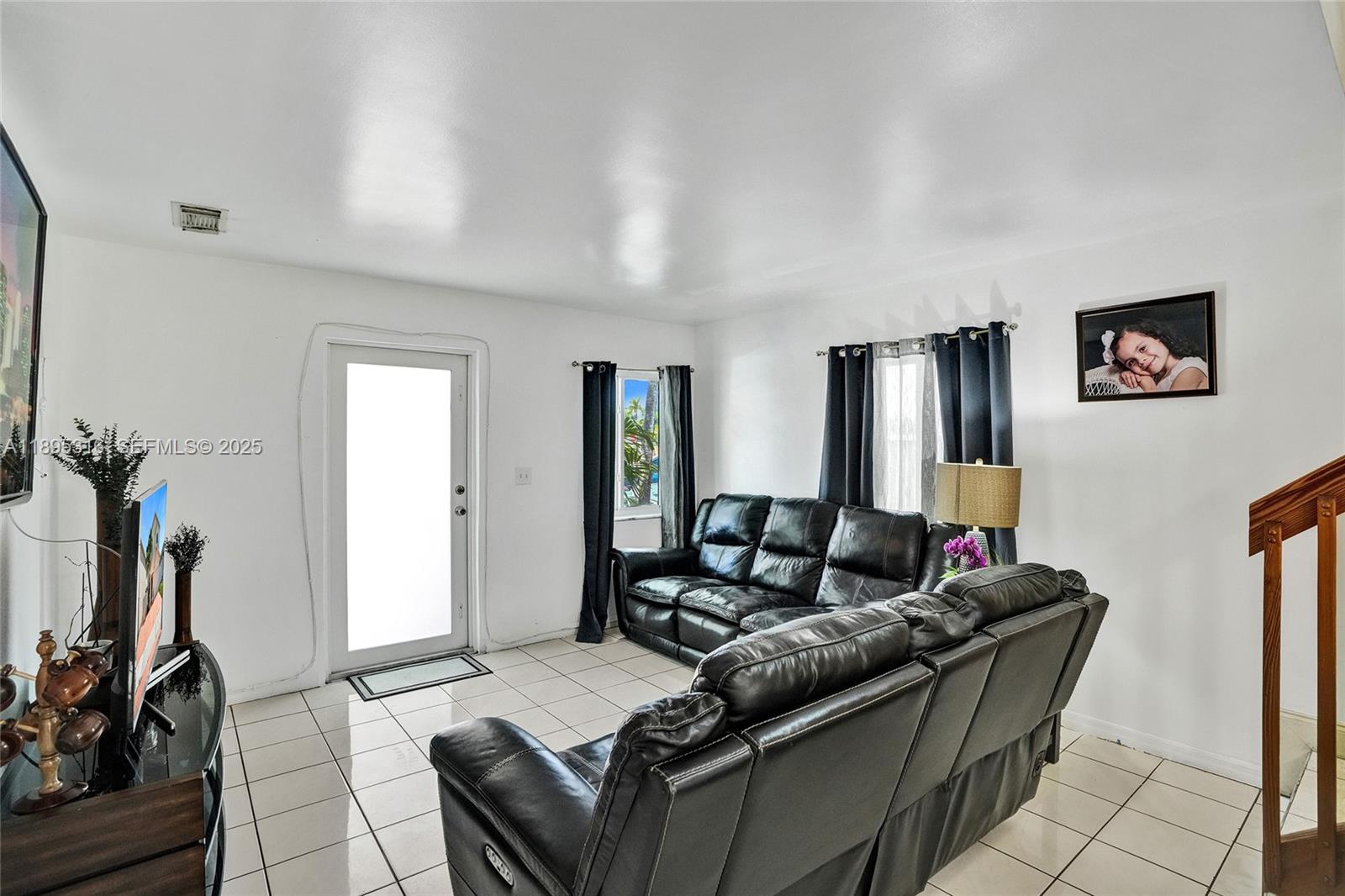13780 Southwest 160th Terrace Miami, FL 33177 - Photo 11 of 42 a living room with furniture and a flat screen tv