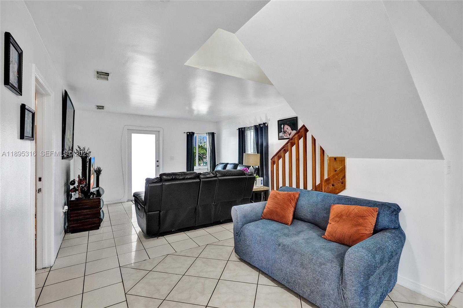 13780 Southwest 160th Terrace Miami, FL 33177 - Photo 15 of 42 a living room with furniture and a couch