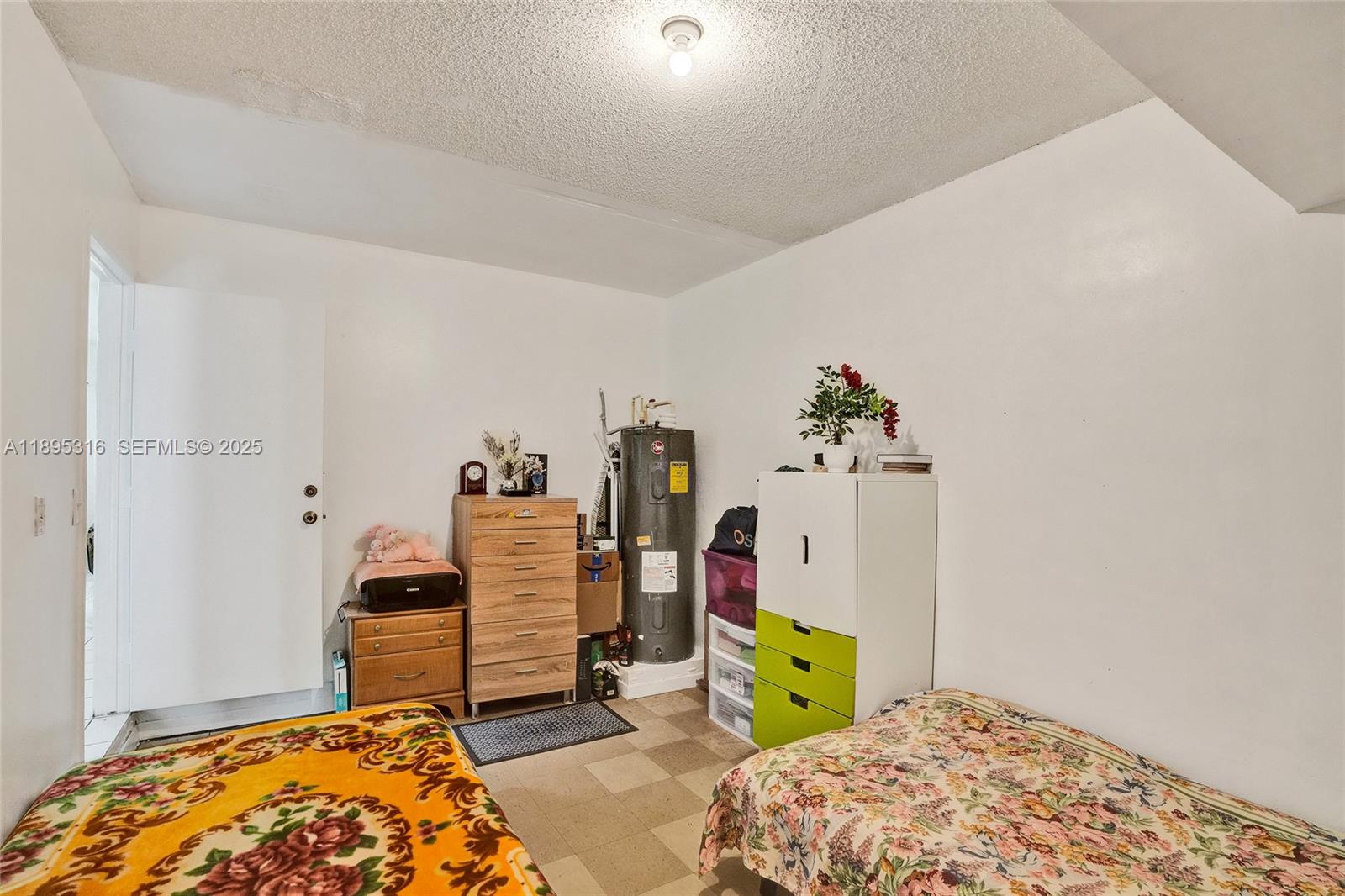 13780 Southwest 160th Terrace Miami, FL 33177 - Photo 17 of 42 a bedroom with bed and closet