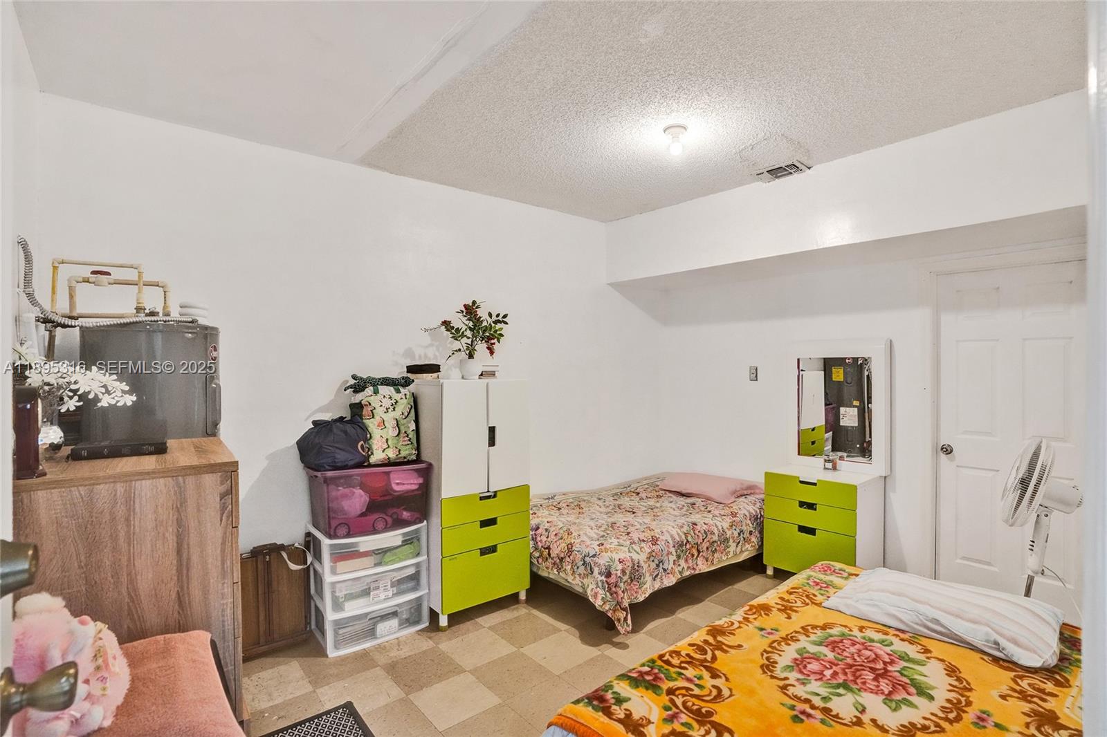 13780 Southwest 160th Terrace Miami, FL 33177 - Photo 18 of 42 a bedroom with a bed and a closet