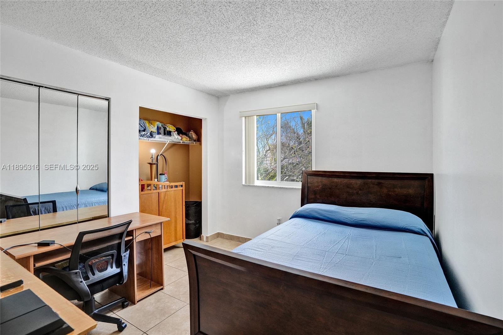 13780 Southwest 160th Terrace Miami, FL 33177 - Photo 22 of 42 a bedroom with a bed and wooden floor