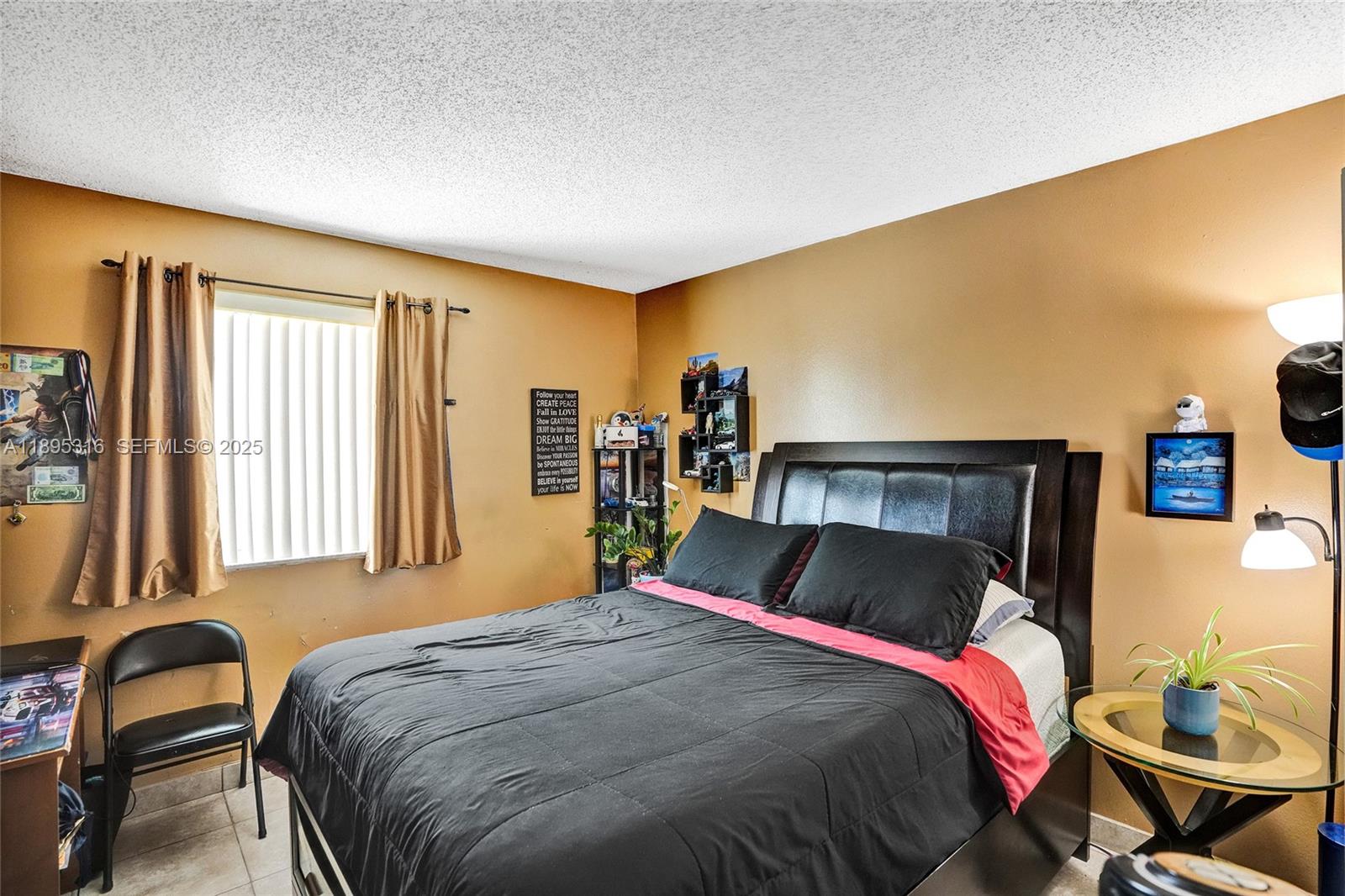 13780 Southwest 160th Terrace Miami, FL 33177 - Photo 24 of 42 a bedroom with a bed and wooden floor