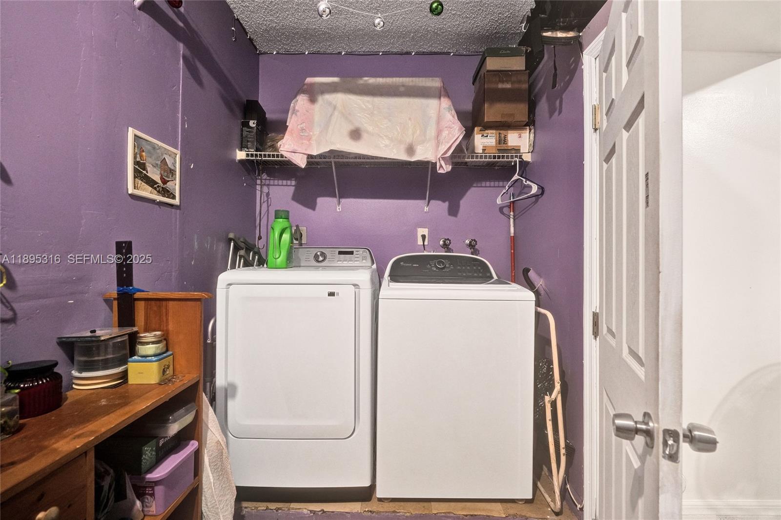 13780 Southwest 160th Terrace Miami, FL 33177 - Photo 29 of 42 a utility room with dryer and washer
