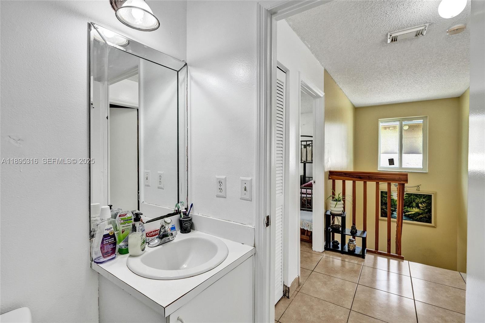 13780 Southwest 160th Terrace Miami, FL 33177 - Photo 30 of 42 a bathroom with a sink and a mirror