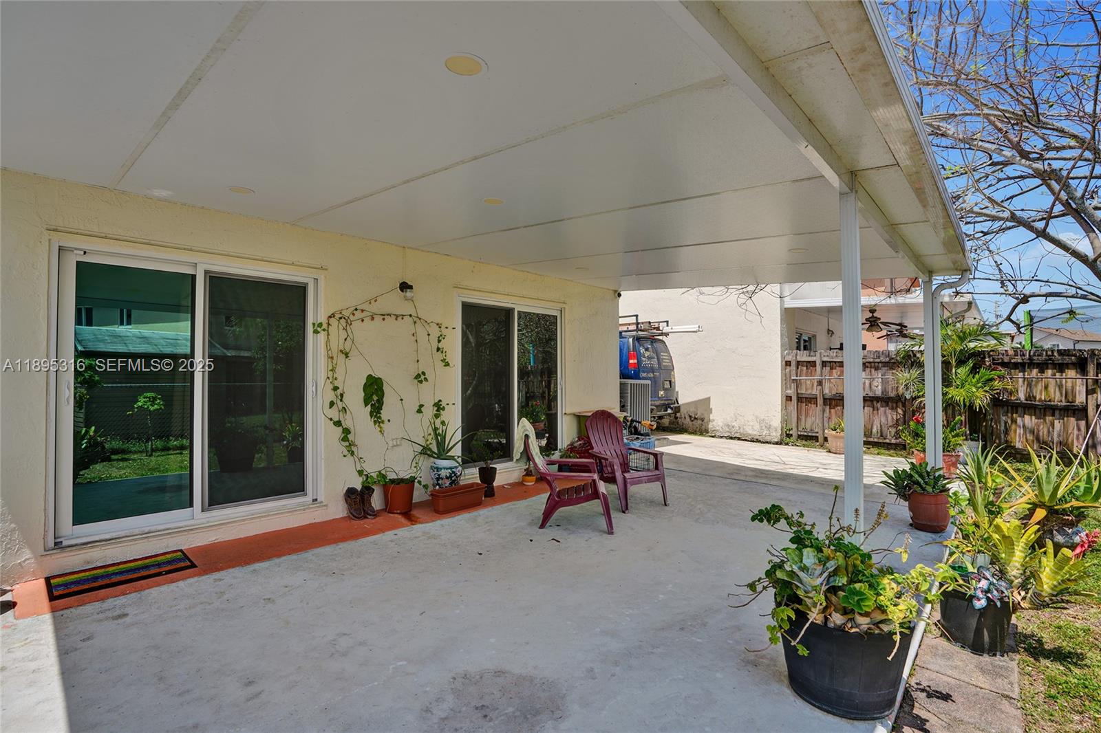 13780 Southwest 160th Terrace Miami, FL 33177 - Photo 35 of 42 a living room filled with furniture and a potted plant