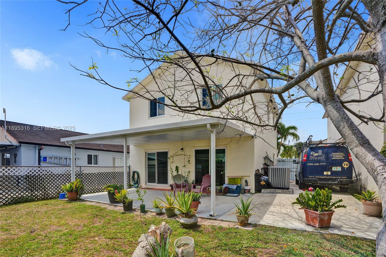 13780 Southwest 160th Terrace Miami, FL 33177 - Photo 38 of 42 a view of a house with a chairs in patio