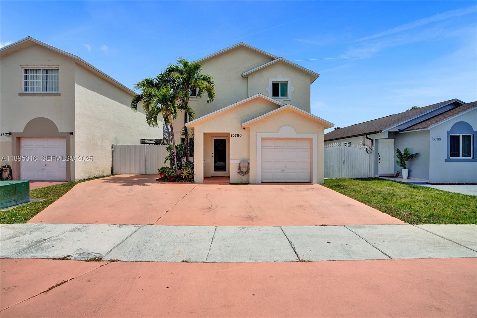 13780 Southwest 160th Terrace Miami, FL 33177 - Photo 40 of 42 a front view of a house with a yard