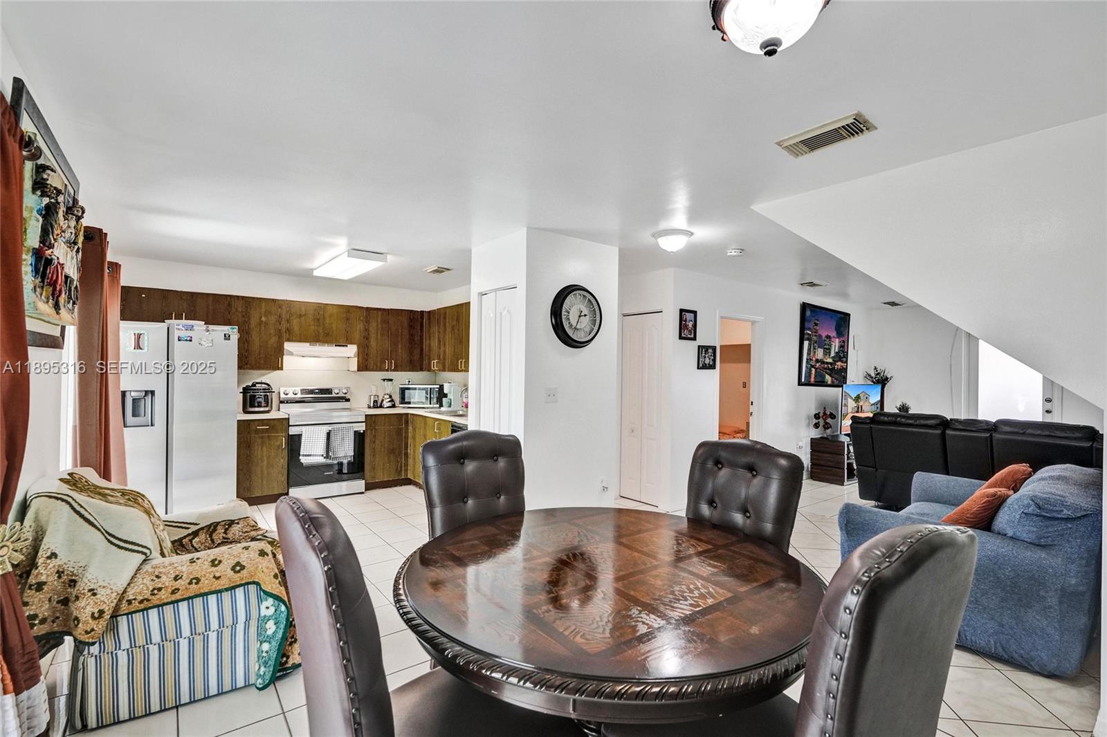 13780 Southwest 160th Terrace Miami, FL 33177 - Photo 8 of 42 a dining room with furniture kitchen view and a large window