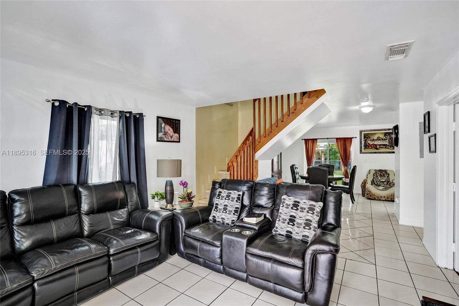 13780 Southwest 160th Terrace Miami, FL 33177 - Photo 10 of 42 a living room with furniture and a large window