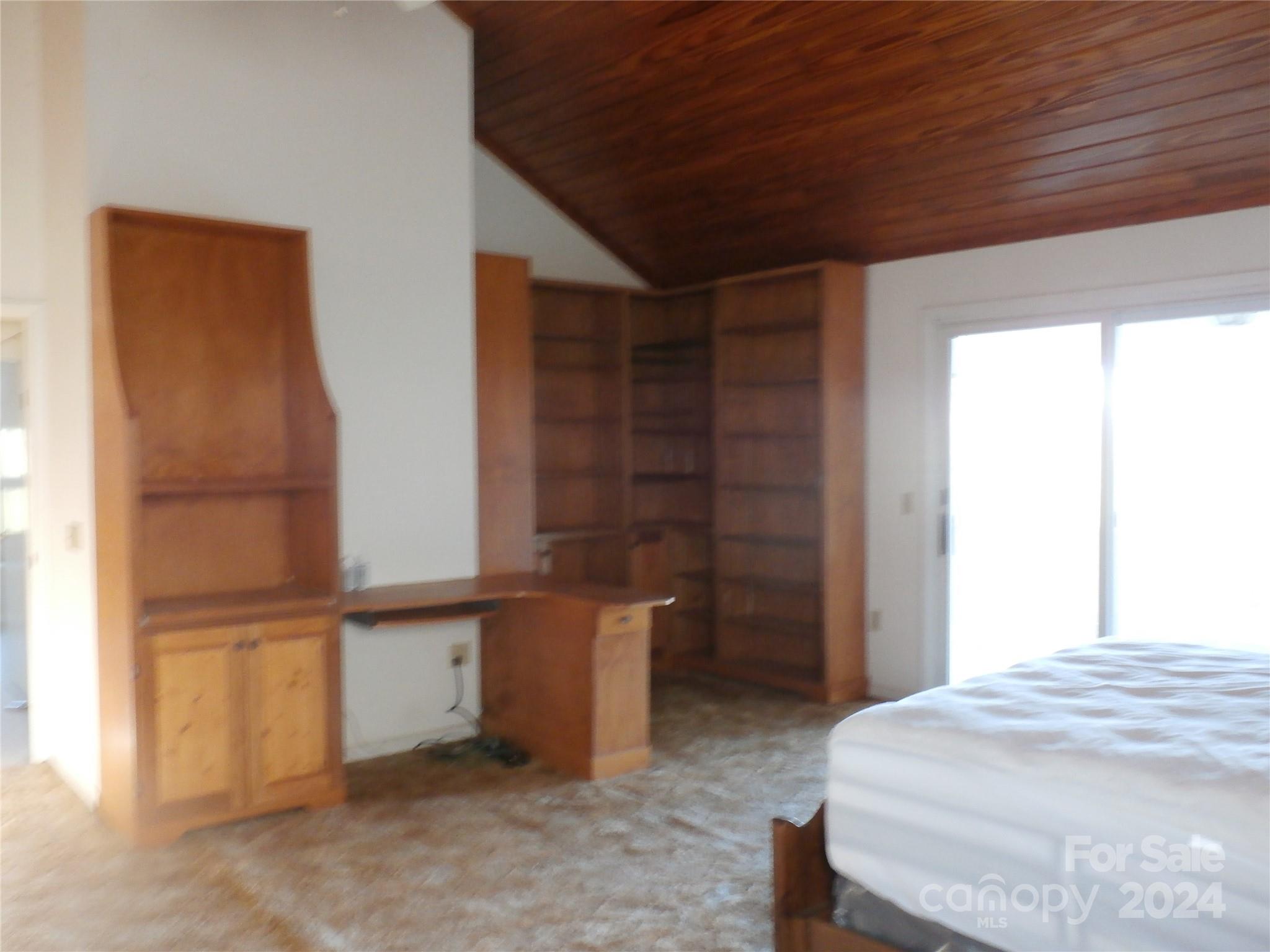 288 Firetower Road Spruce Pine, NC 28777 - Photo 15 of 47 a bed room with a bed and a window
